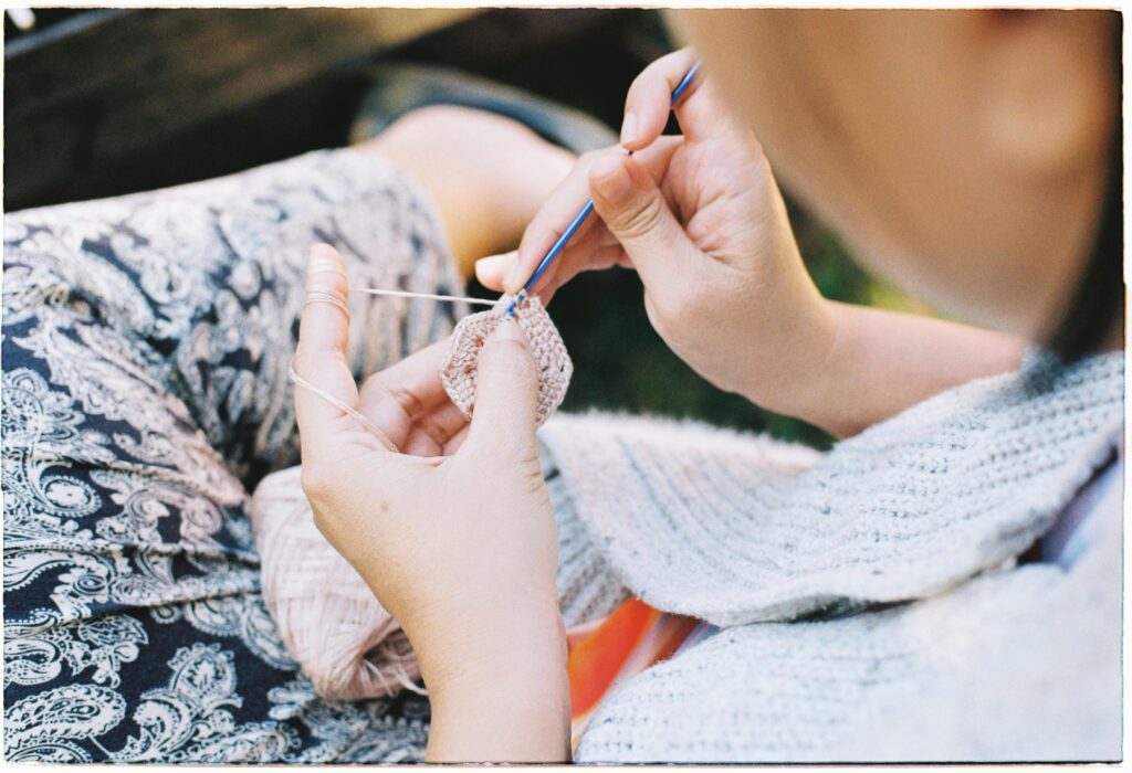 Moms crocheting together in the community - The Daily Stitch
